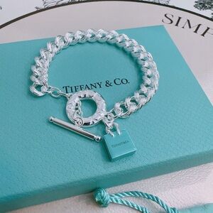 Tiffany & Co. Silver Link Toggle Bracelet with Blue Mini Bag Charm